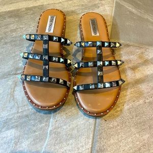 Black Steve Madden sandals with spike embellishments
